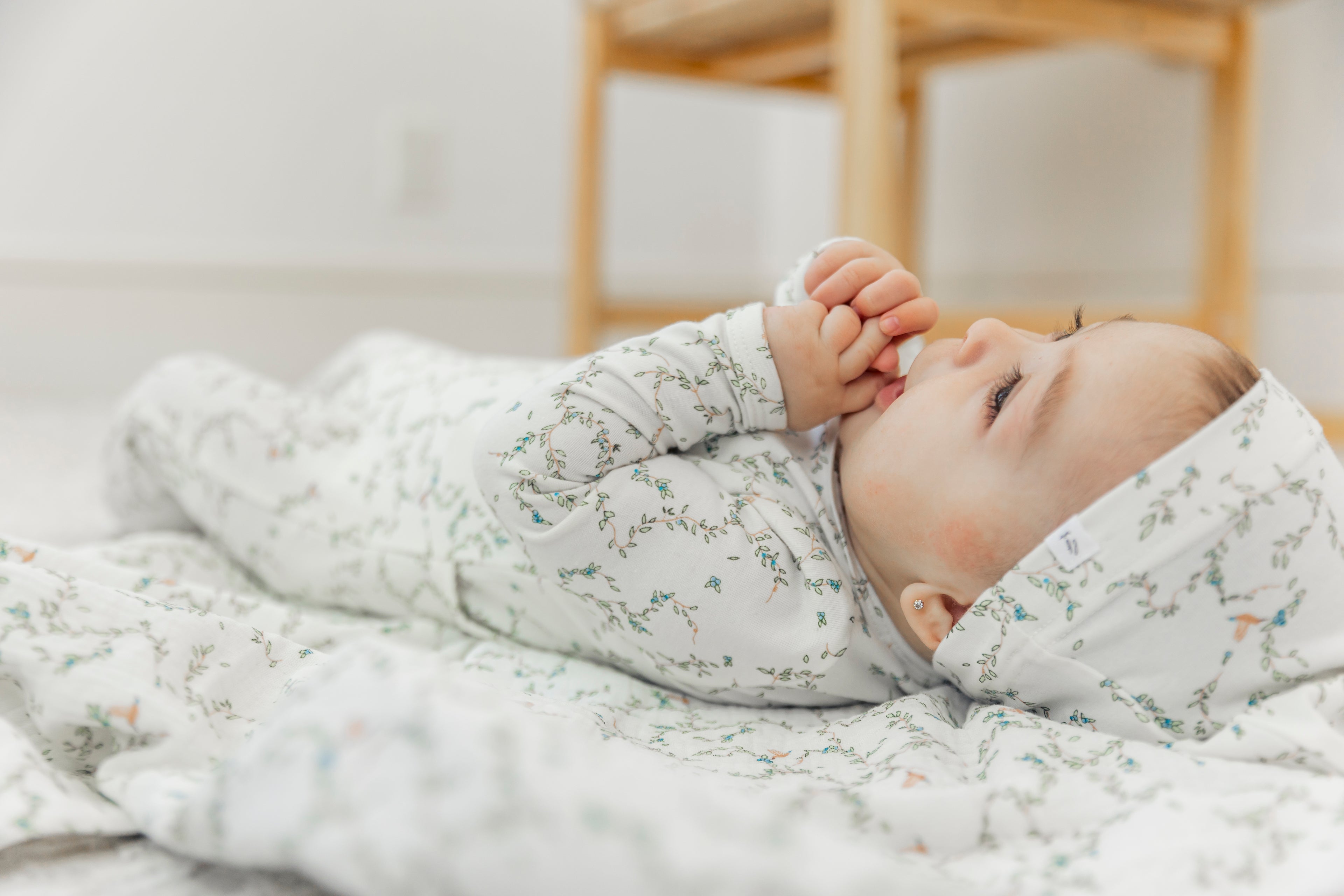 Leaves and Bird Print Swaddle in by Little Fragile