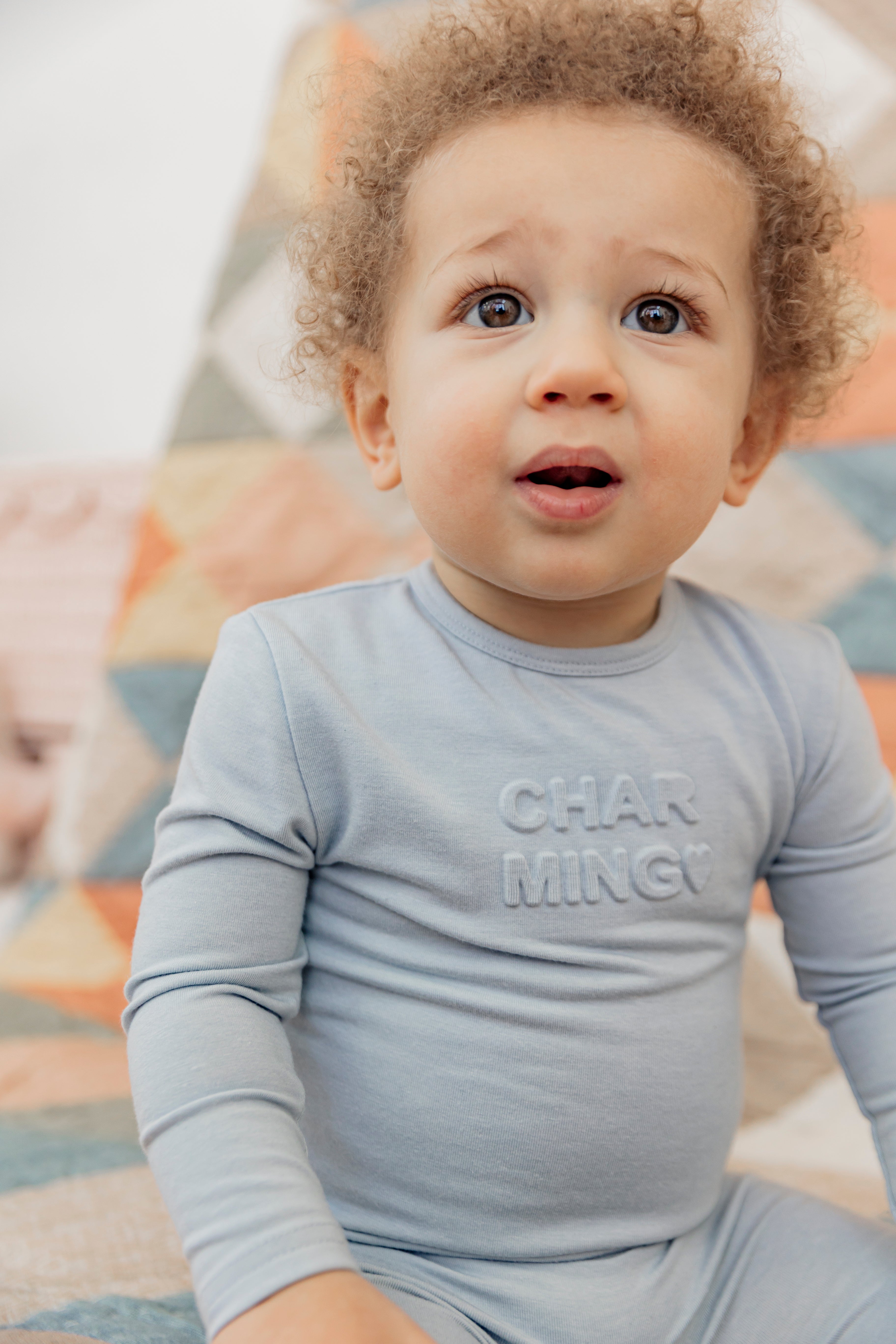 Charming and Darling Print Onesie in by Bebe Bella