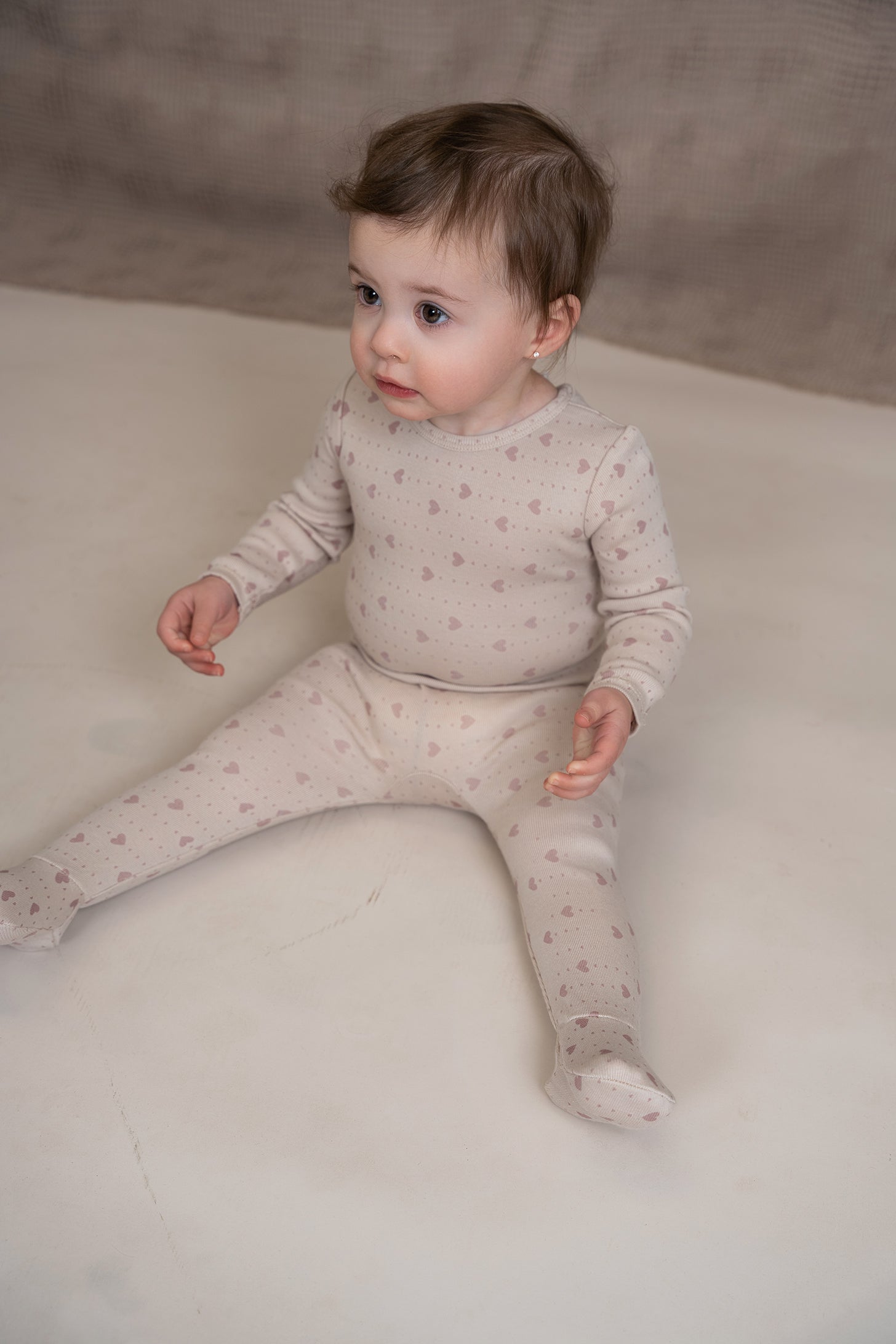 Star and Heart Print Onesie in by Whipped Cocoa