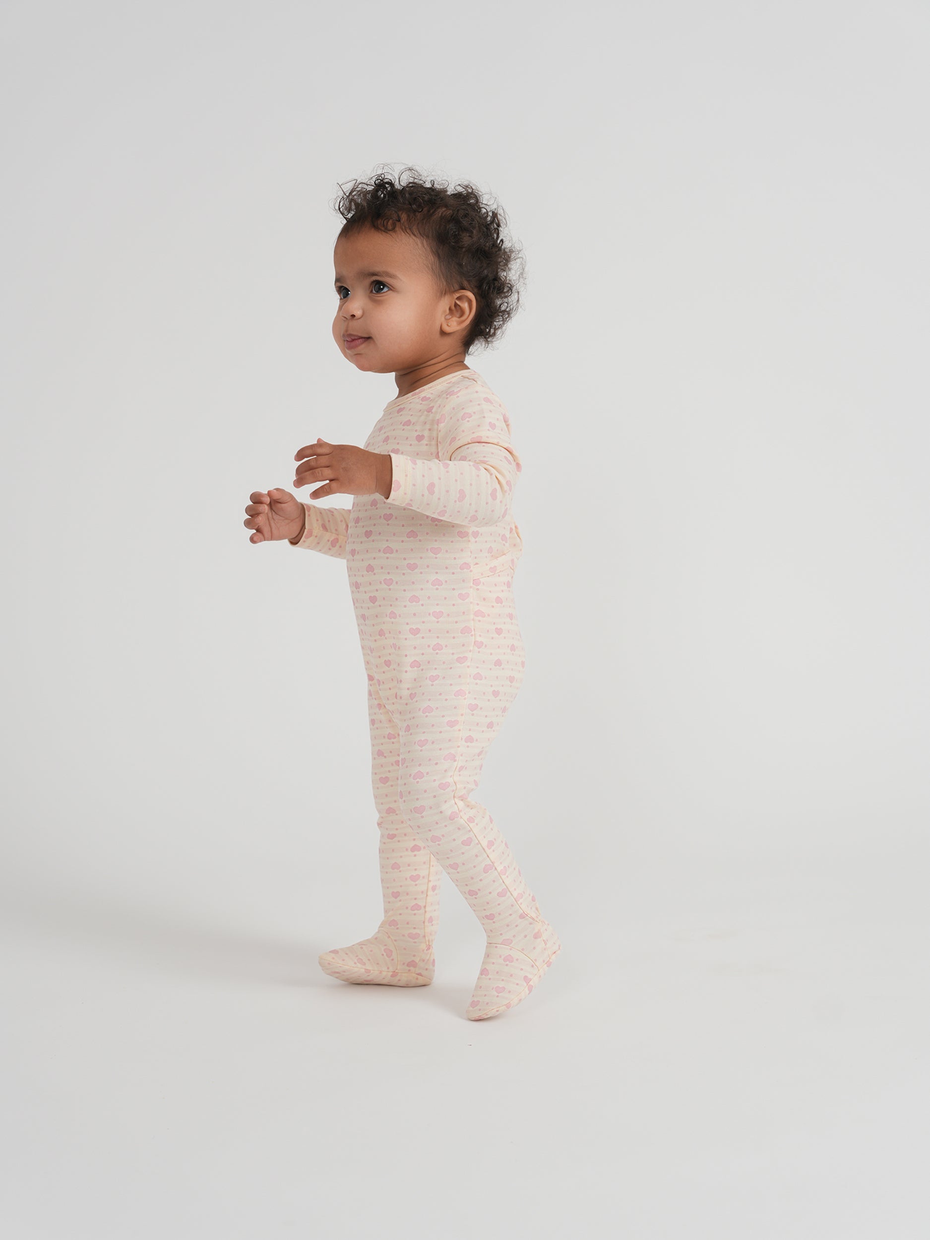 Stripped Dotted Heart and Star Onesie in by Whipped Cocoa