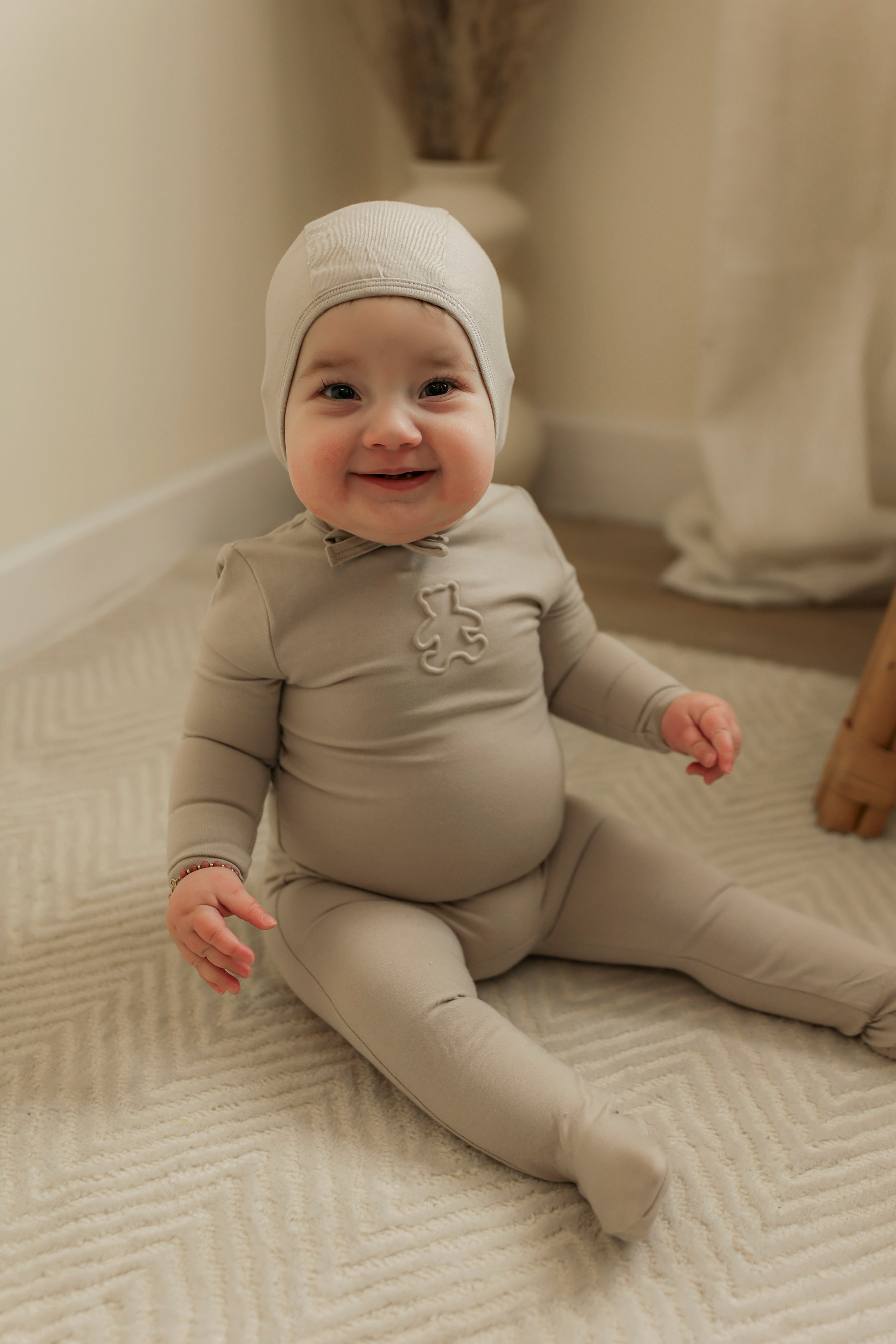 Embossed Bear Onesie in by Bebe Bella