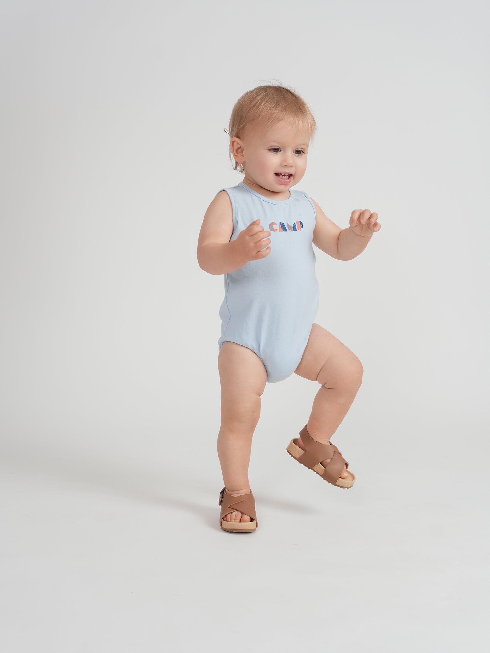 Multi Color Stripe Onesie in by Puddles