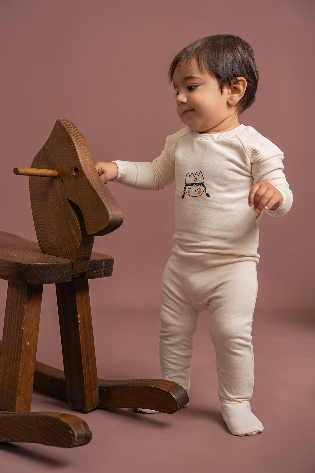 Crown Print Onesie in by Charlotte & George