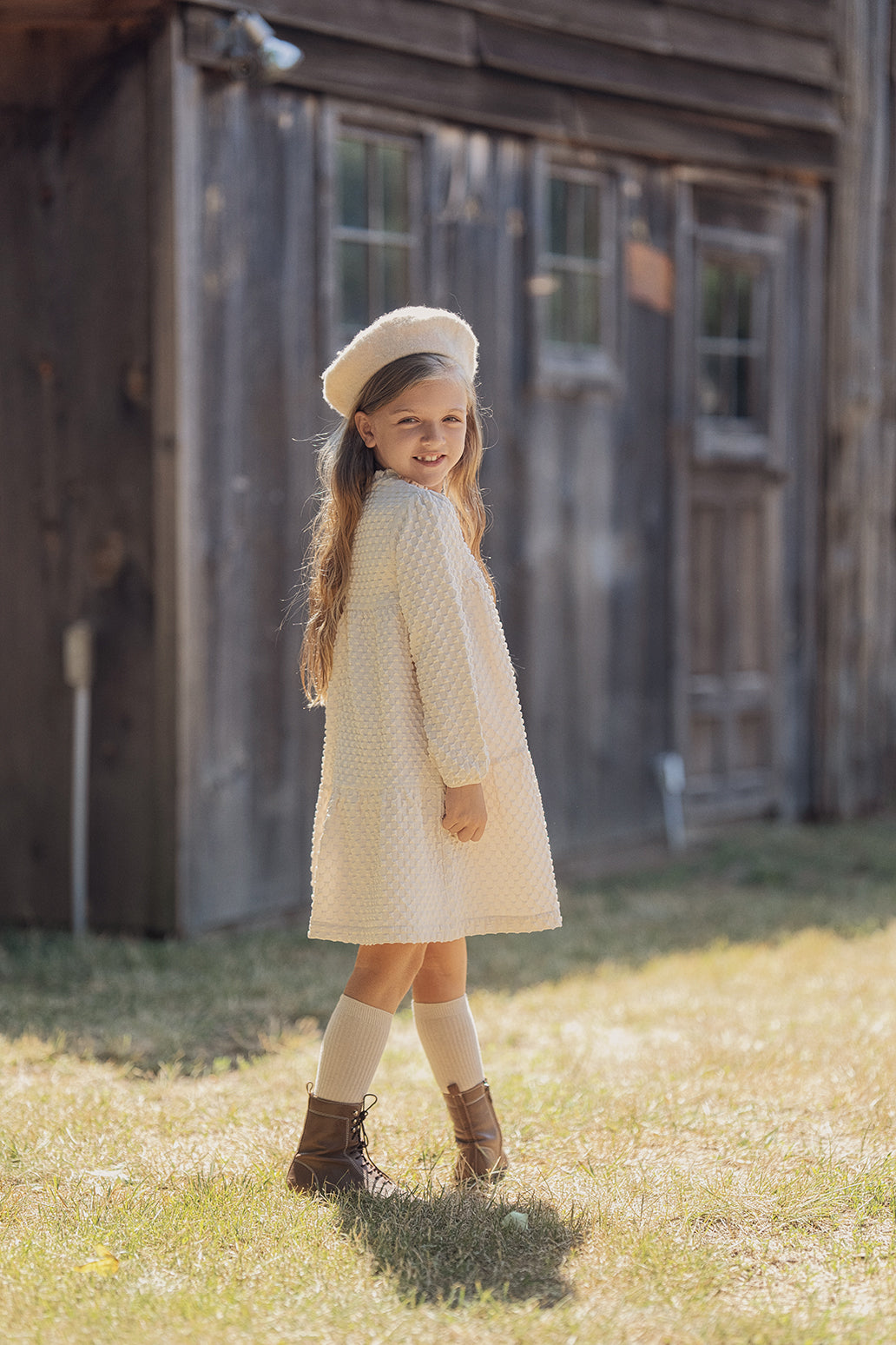 Puff Textured Woven Dress in by Charlotte & George