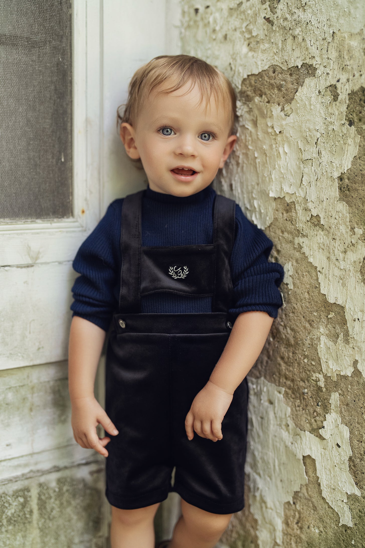 Crest Embroidery Shorts Overall in Black by Charlotte & George