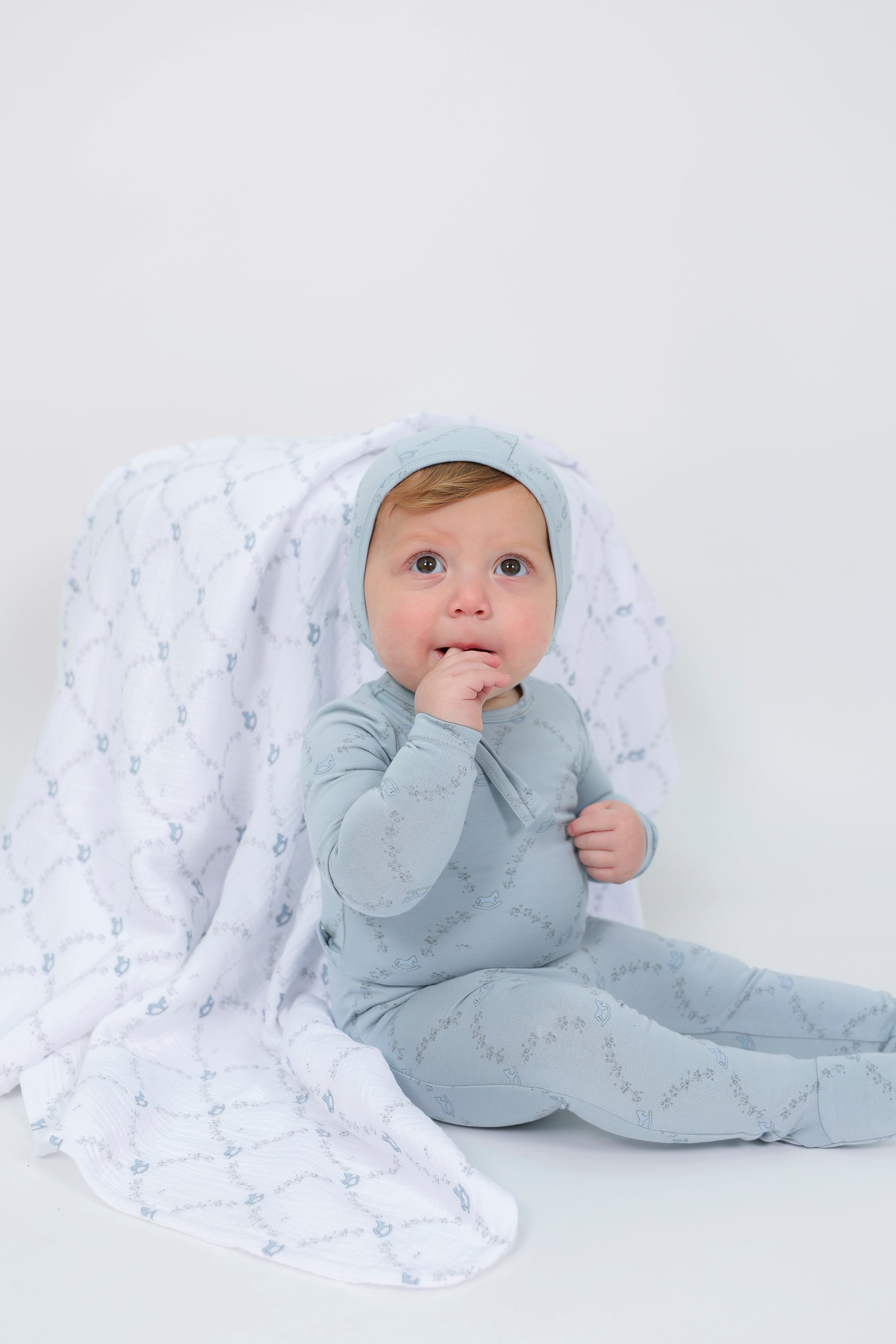 Rocking Horse Print Swaddle in by Bebe Bella