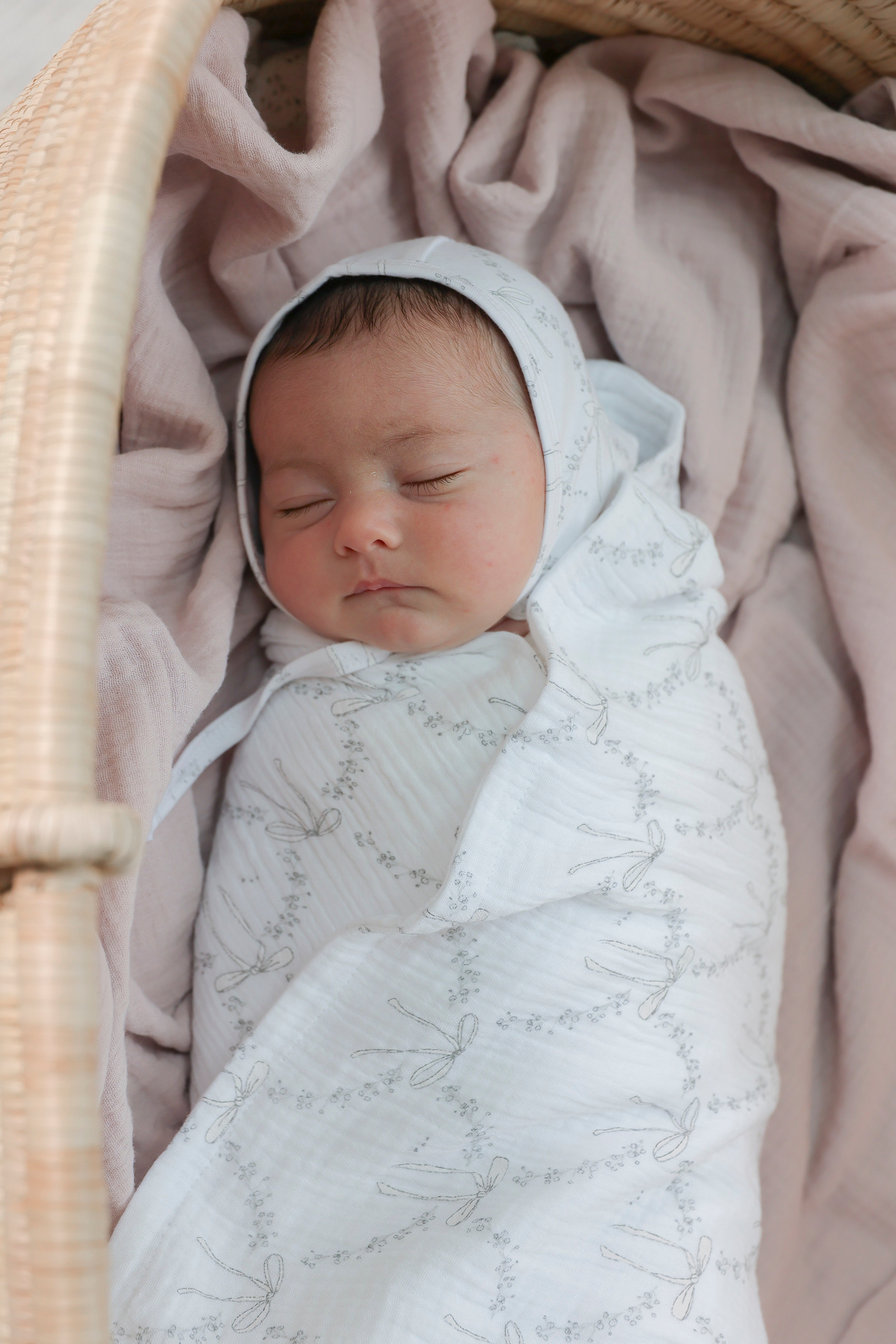 Bow Print Swaddle in by Bebe Bella