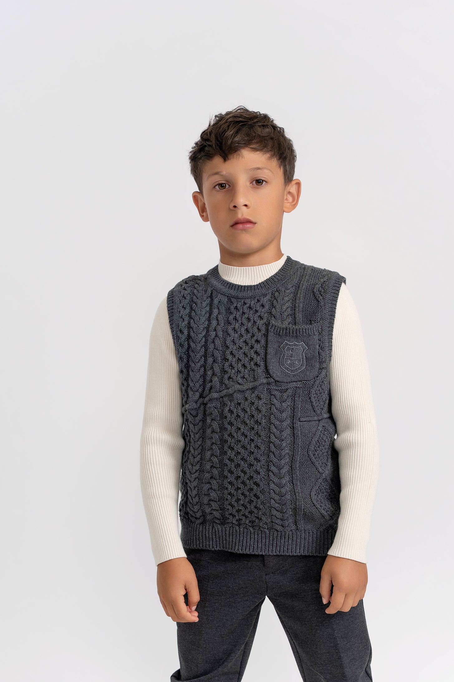 Crest Knitted Vest in by Space Grey